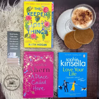 selection of women's fiction books laid flat with cup of coffee and biscuits