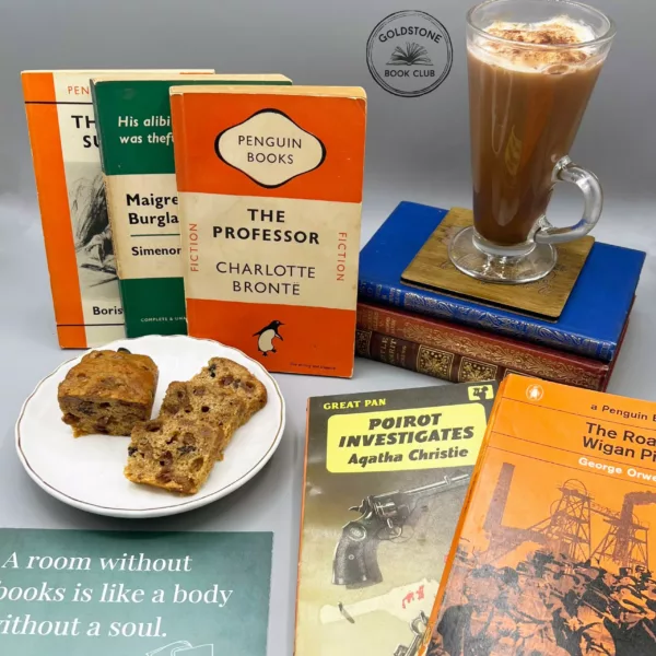 Collection of vintage Penguin and Ladybird vintage fiction books, with a tall glass cup of cream topped hot chocolate and a plate with delicious sliced Bara Brith